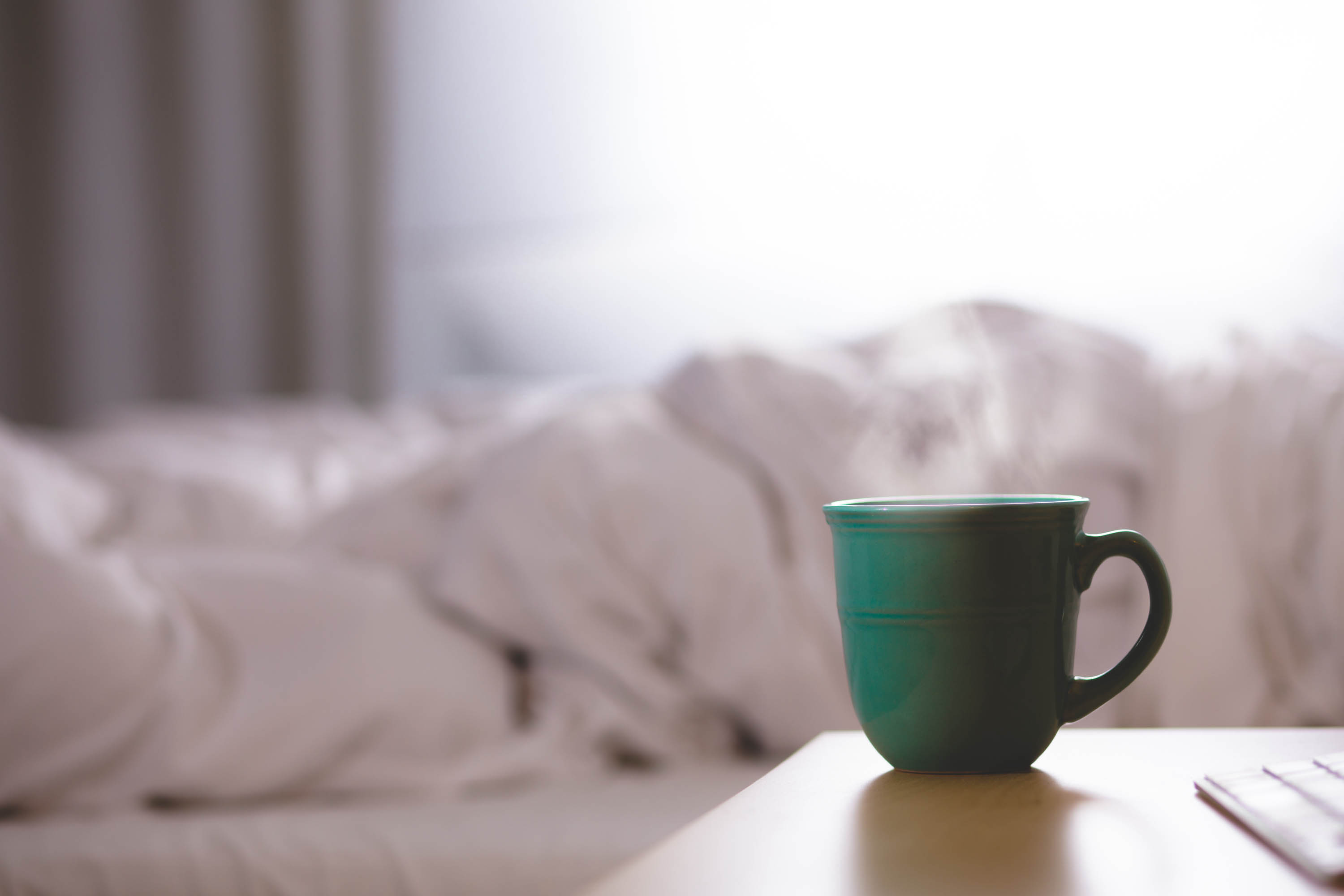Coffee mug near bed